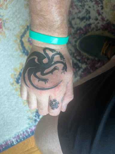 Explore black bird tattoo ideas, creative tattoo ideas in Laconia, available at Circus Tattoo