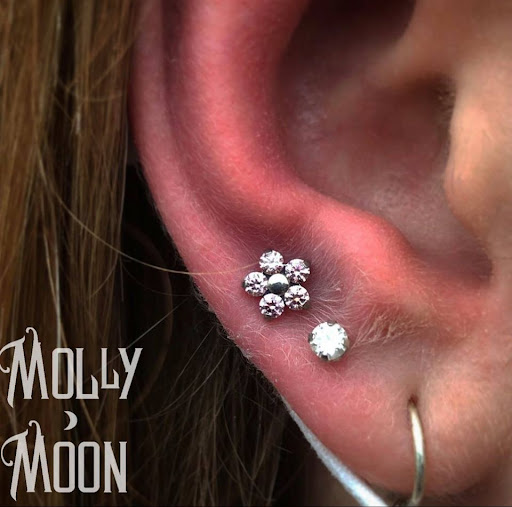 Explore solid tattoo ideas, creative tattoo ideas in Oshkosh, available at Piercings by Molly Moon at 920 Tattoo and Piercing