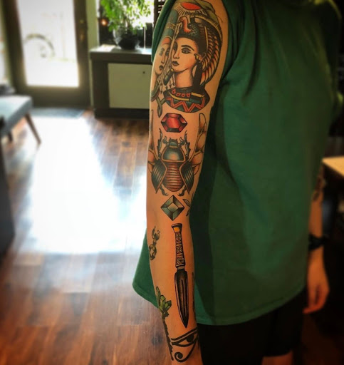Explore rose hand tattoo ideas, creative tattoo ideas in Lawrence, available at Standard Electric Tattooing