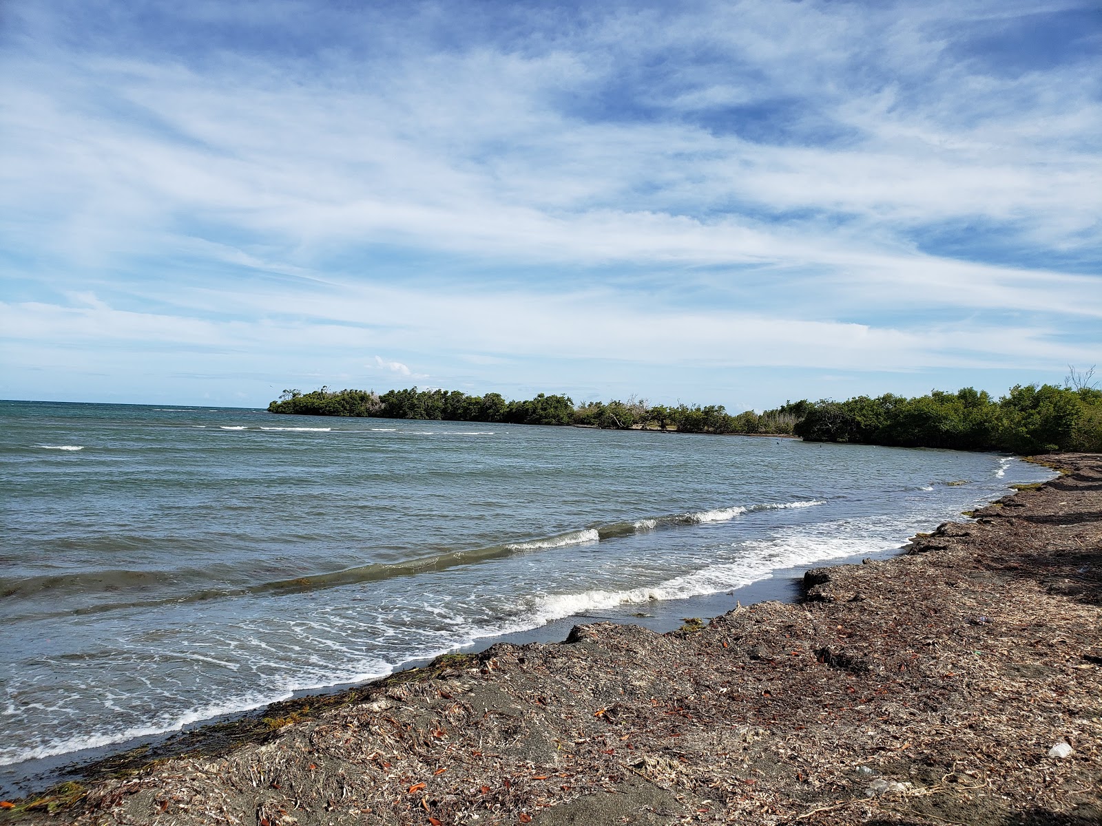 Foto di Playa Clavellina con una superficie del sabbia grigia