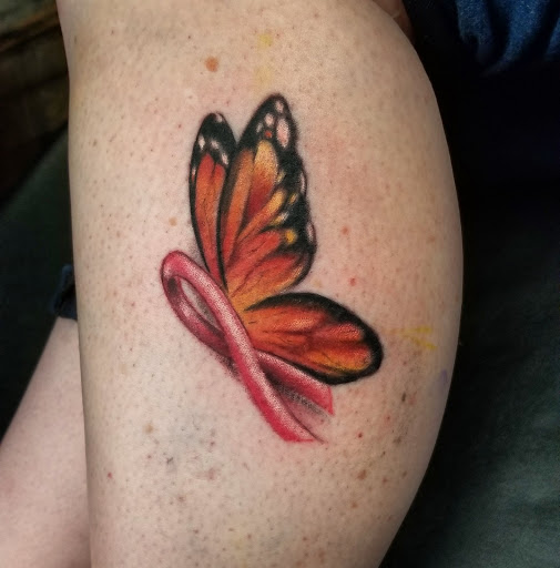 Explore thigh tattoo ideas for men, creative tattoo ideas in East Windsor, available at AAA Tattoo