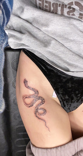 Explore lady thigh tattoo ideas, creative tattoo ideas in Oceanside, available at Maritime Tattoo & Body Piercing