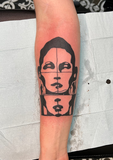 Explore floral tattoo cover up ideas, creative tattoo ideas in Milwaukee, available at MANIA Tattoos Milwaukee