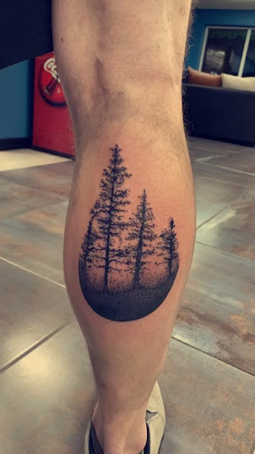 Explore fist tattoo ideas, creative tattoo ideas in Foley, available at Symbolic Ink Tattoo Studio