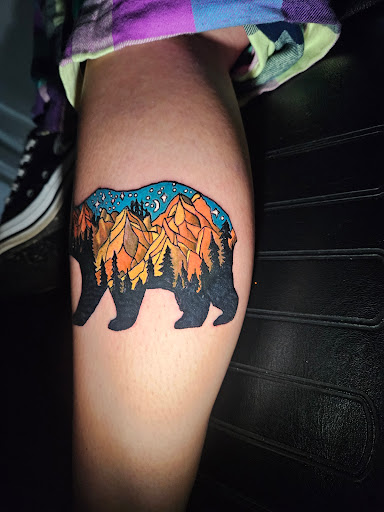 Explore tattoo ideas for men upper arm, creative tattoo ideas in Angola, available at Hoodlum Ink