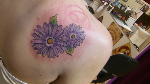 Find tattoo ideas for upper arm men for your next unique tattoo in La Crosse at La Crosse Tattoo