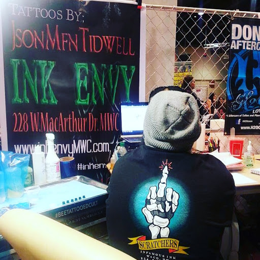 Explore tattoo ideas from books, creative tattoo ideas in Spencer, available at Ink Envy Tattoo And Body Piercing