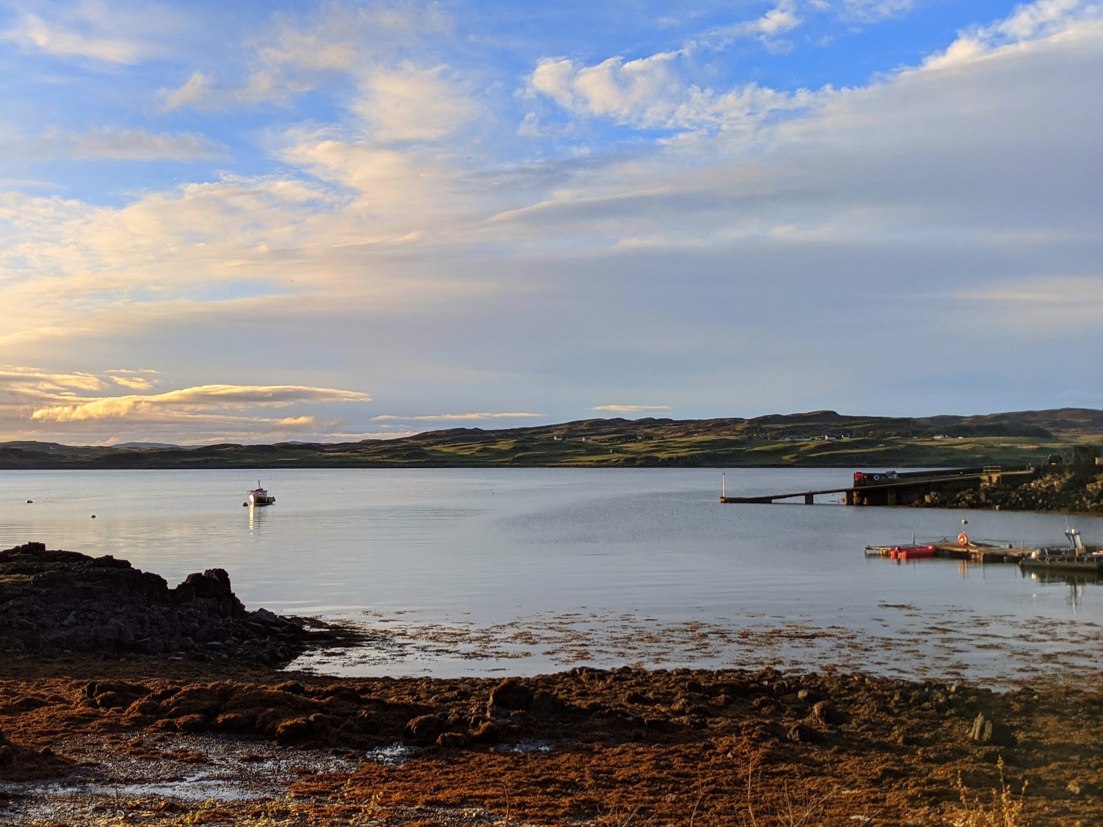 Photo of Portnalong Jetty backed by cliffs