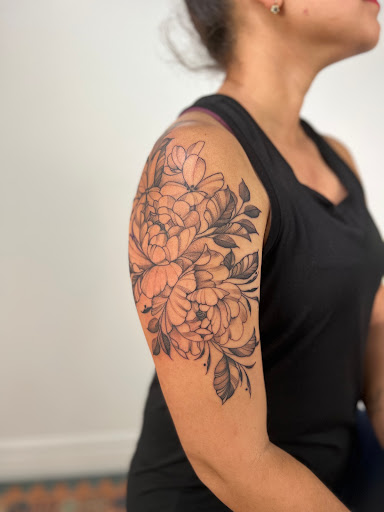 Explore feminine leg tattoo ideas, creative tattoo ideas in Ironwood, available at Iron Ink Tattoos