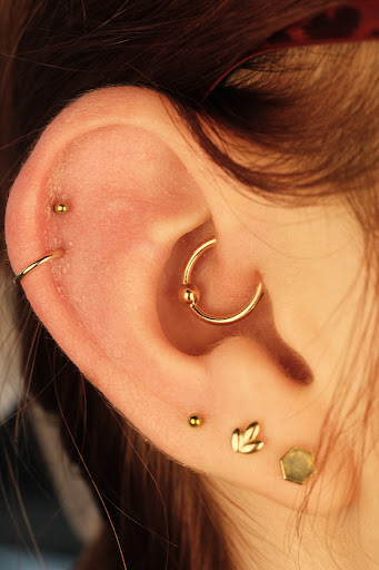 Explore tattoo ideas for last name, creative tattoo ideas in Buffalo, available at Moria Piercing and Jewelry