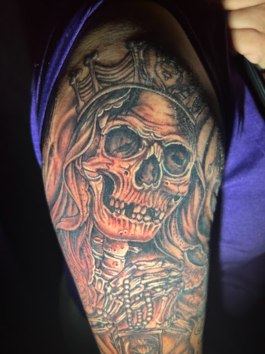 Explore cover up tattoo ideas lower back, creative tattoo ideas in Las Vegas, available at Work of Art Tattoo and Piercing