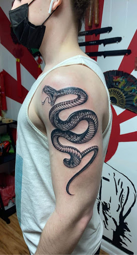 Explore cross tattoo ideas with meaning, creative tattoo ideas in Owosso, available at Expressions Body Art Studio