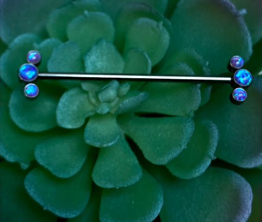 Explore tattoo flag ideas, creative tattoo ideas in Riverside, available at The Pierced Tai