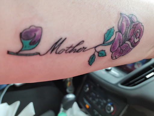 Explore cover up tattoo ideas for lower back, creative tattoo ideas in Penn Yan, available at The Tattoo Shop