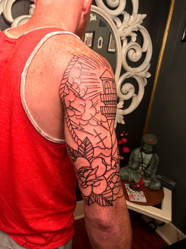 Explore chest tattoo lettering ideas, creative tattoo ideas in Houston, available at Houston Heights Tattoo & Piercing
