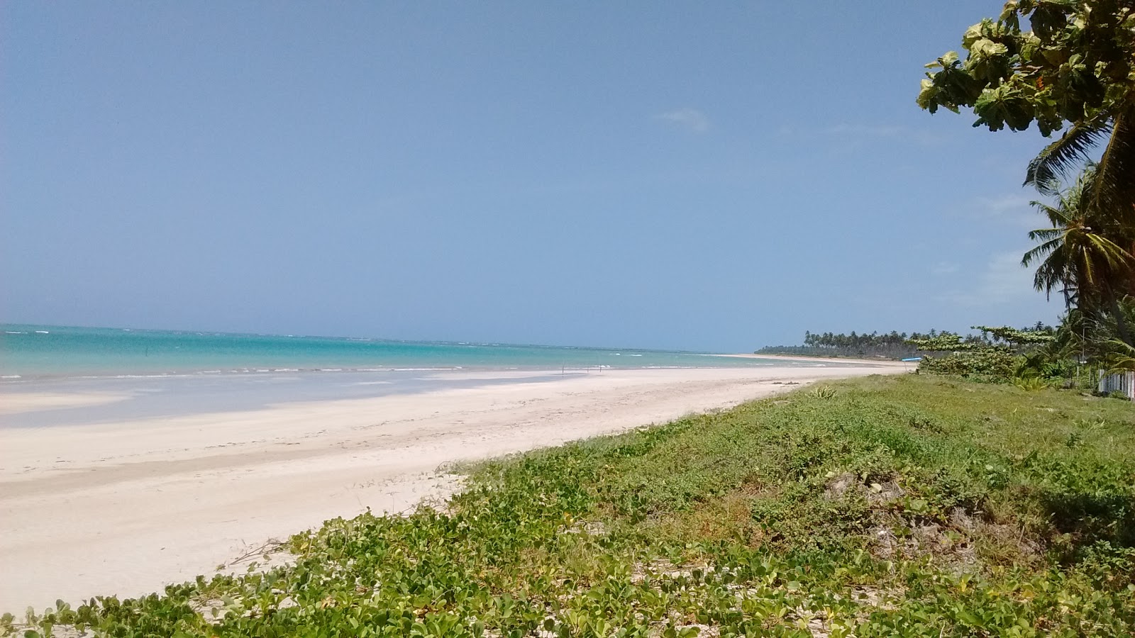Foto de Praia do Riacho e o assentamento