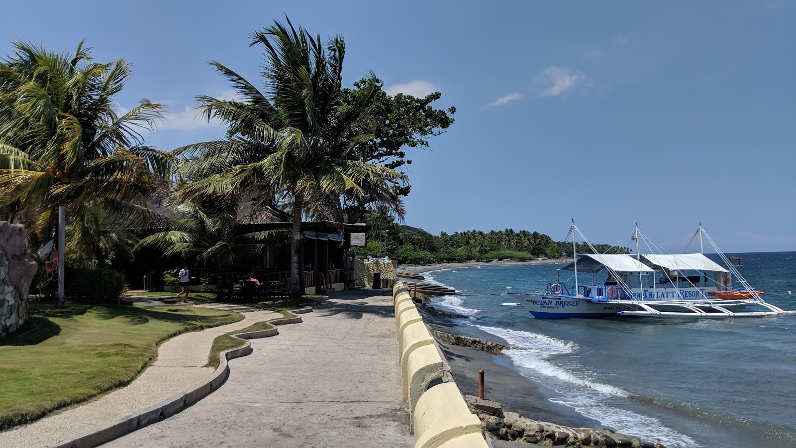 Foto van Zamboanguita Beach met grijs zand oppervlakte