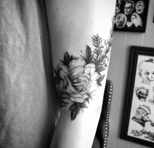 Explore red ink tattoo ideas, creative tattoo ideas in Lawrence, available at Standard Electric Tattooing