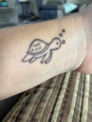Explore leg tattoo ideas for women, creative tattoo ideas in Davenport, available at Fine Ink Studios Tattoos