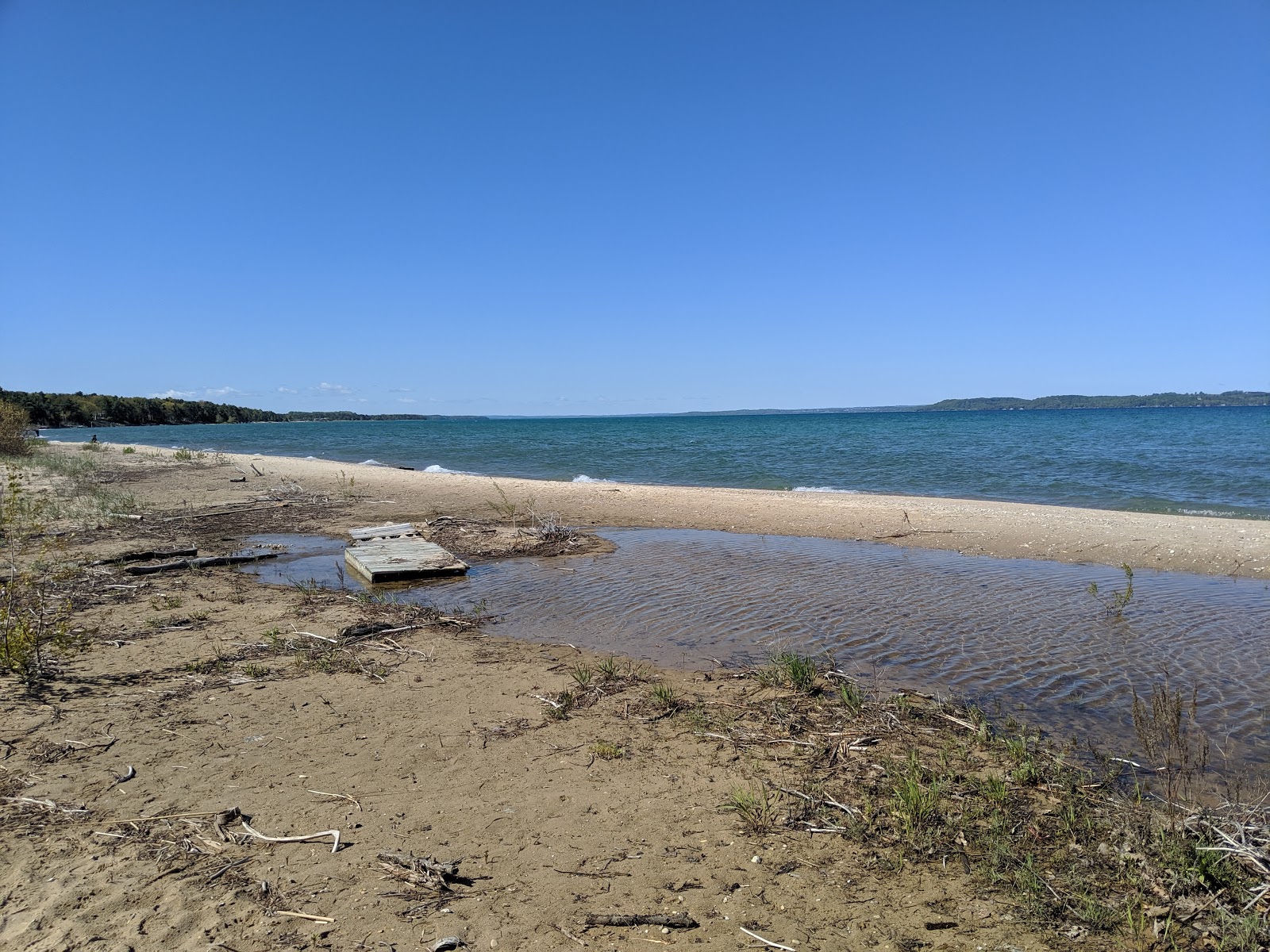 Photo of Elk Rapids Day Beach with turquoise pure water surface