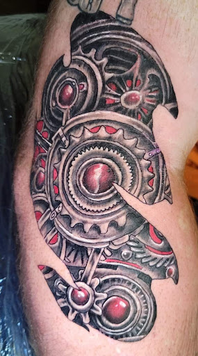 Explore knitting tattoo ideas, creative tattoo ideas in Angola, available at Hoodlum Ink