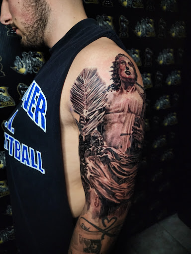 Explore men chest tattoo ideas, creative tattoo ideas in Warren, available at Dark Horse Tattoo Co. LLC.