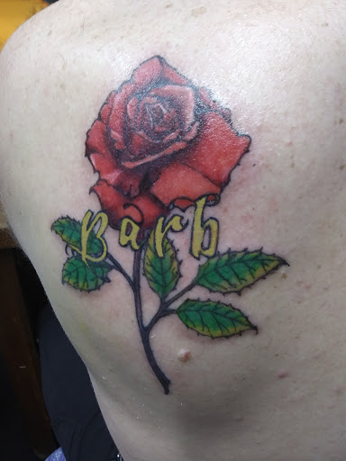 Explore purple tattoo ideas, creative tattoo ideas in Carlinville, available at MaloneTattoo