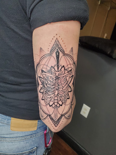 Explore red bird tattoo ideas, creative tattoo ideas in Albuquerque, available at Relic Tattoo Co.