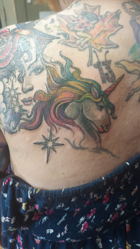 Explore sun tattoo ideas for females, creative tattoo ideas in Peoria, available at Iron Key Tattoo Studio Inc.