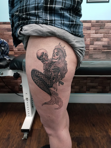 Explore knee tattoo ideas for woman, creative tattoo ideas in Calhoun, available at Velvet Panther Tattoo and Piercing