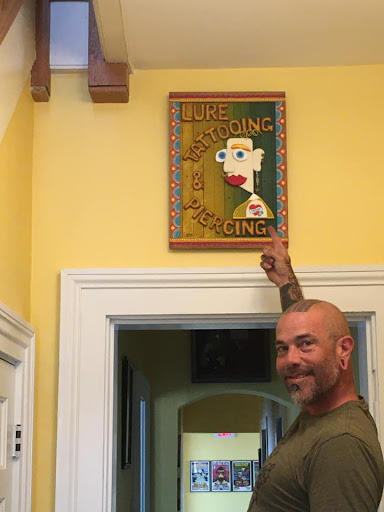 Explore tattoo flag ideas, creative tattoo ideas in Marietta, available at Lure Tattooing & Piercing LLC