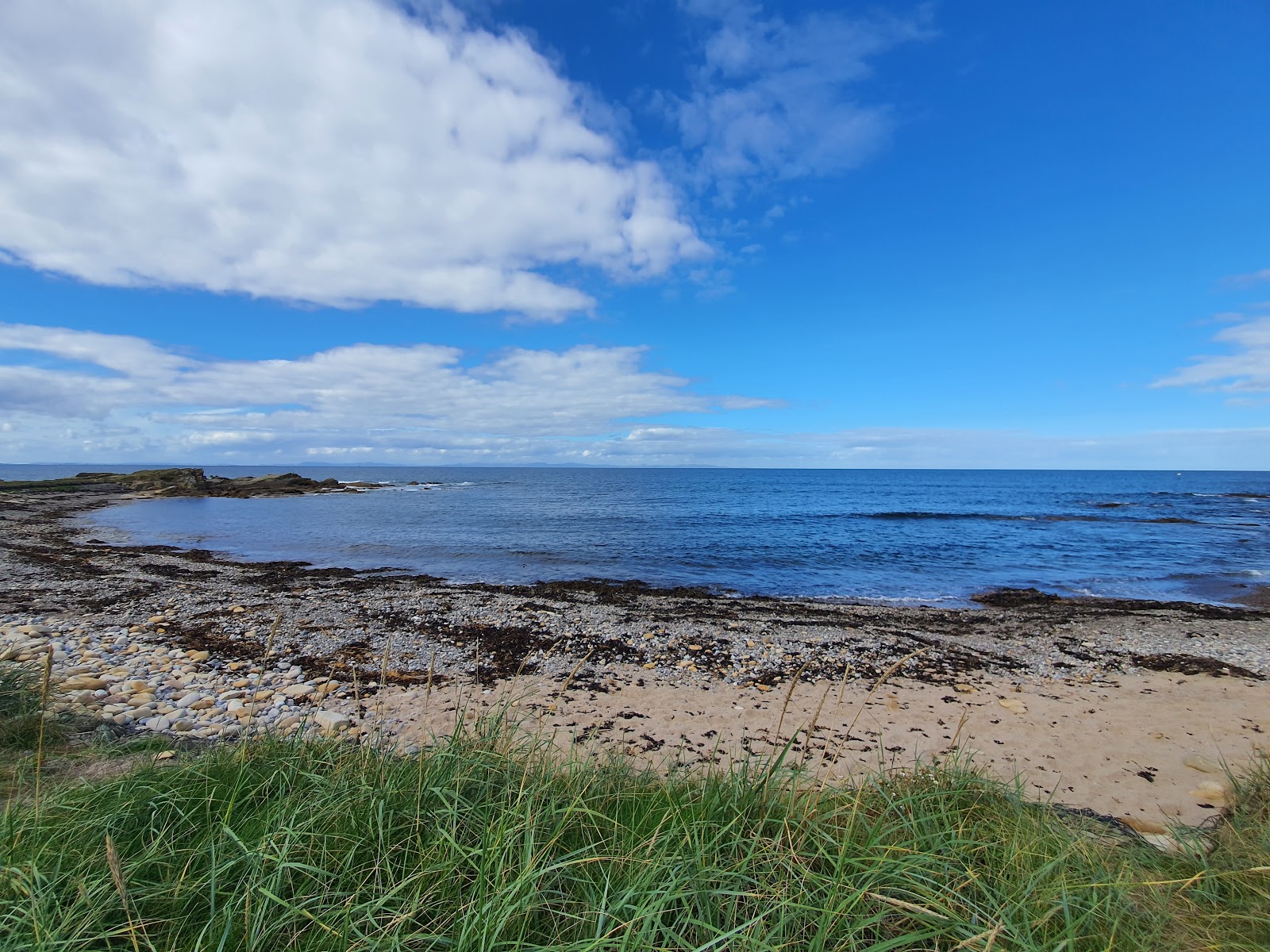 Foto van Colach Bay Beach met turquoise puur water oppervlakte