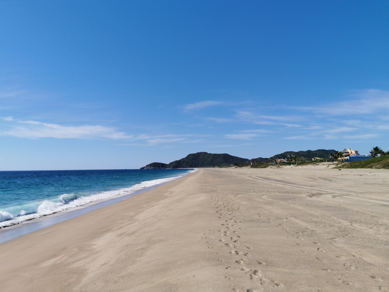 Photo de Playa el Coco II avec sable fin brun de surface