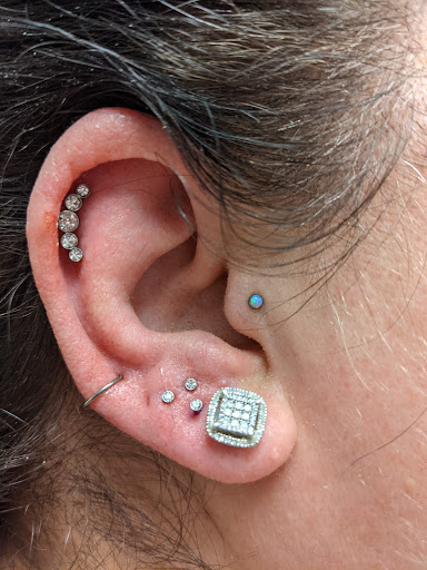 Explore joker hand tattoo ideas, creative tattoo ideas in Saint George, available at Medusas Piercing Studio