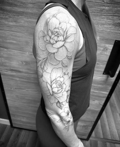 Find sunflower tattoo ideas for females for your next unique tattoo in Rochester at Ash Tattoo