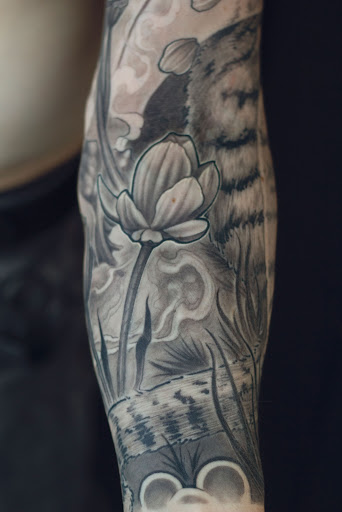 Explore tulip tattoo ideas, creative tattoo ideas in Hudson, available at The Bohemian Social Club