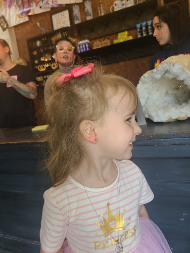 Explore name tattoo ideas on neck, creative tattoo ideas in Rockford, available at Delicious Ink Tattoo & Piercing