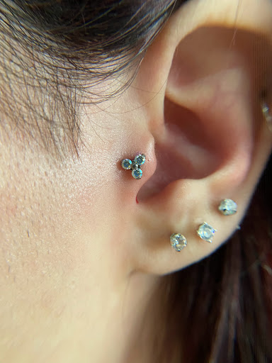 Explore balloon tattoo ideas, creative tattoo ideas in Orange, available at Symbiosis Body Piercing