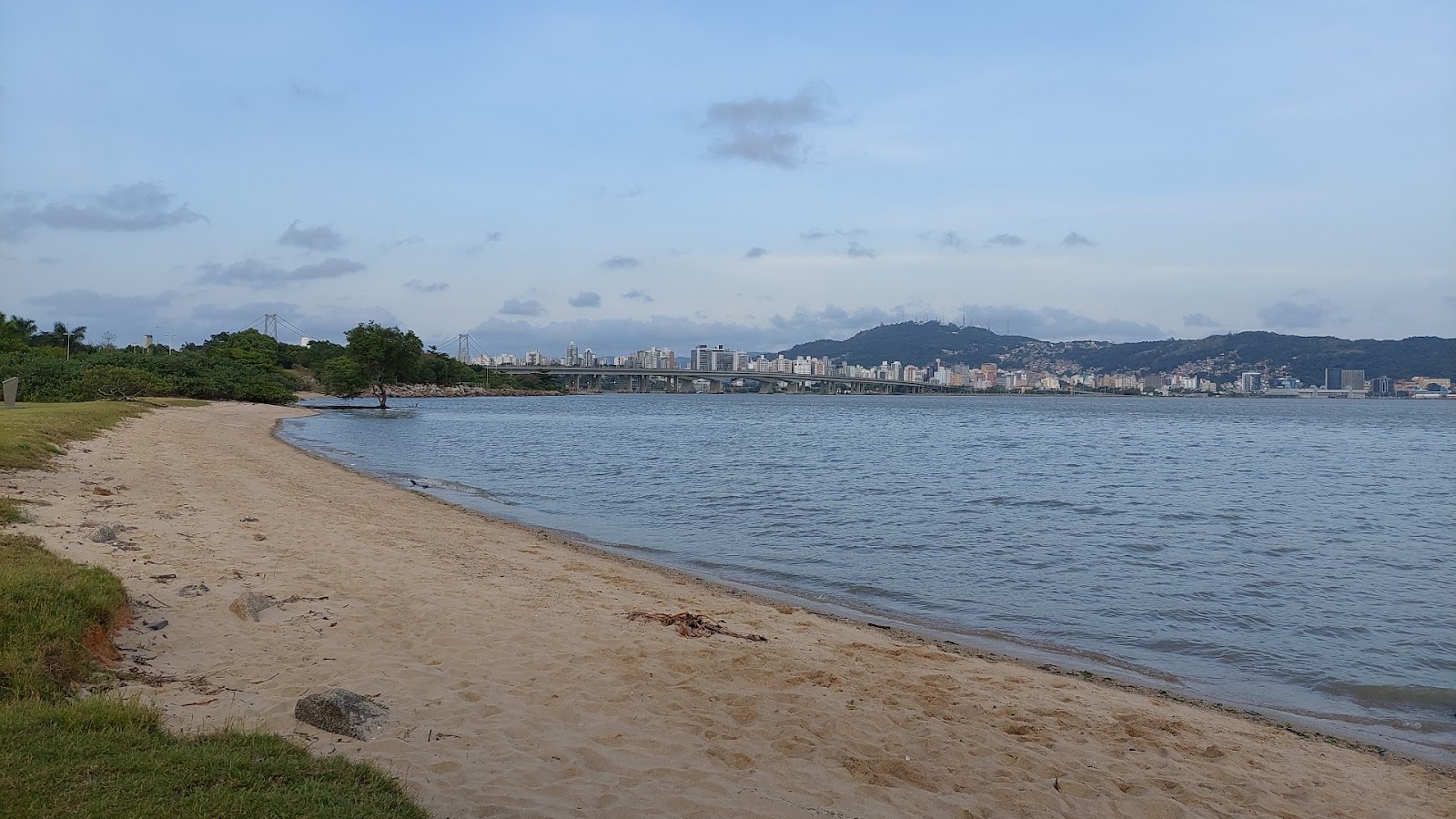 Foto af Praia do Rizzo med lys sand overflade