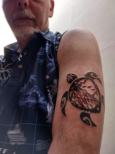 Explore red cardinal tattoo ideas, creative tattoo ideas in Honolulu, available at Skin Deep Tattoo and Piercing Waikiki
