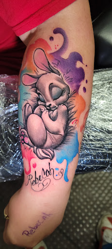 Explore long beach tattoo ideas, creative tattoo ideas in Angola, available at Hoodlum Ink