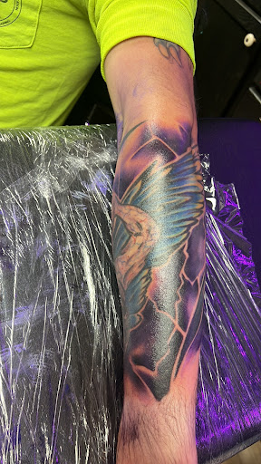 Explore spartan helmet tattoo ideas, creative tattoo ideas in Jefferson, available at Slammin Ink Tattoo