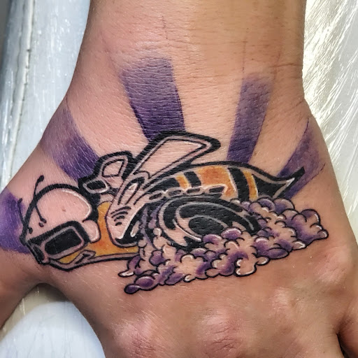 Explore rose hand tattoo ideas, creative tattoo ideas in Shelbyville, available at The Copper Phoenix