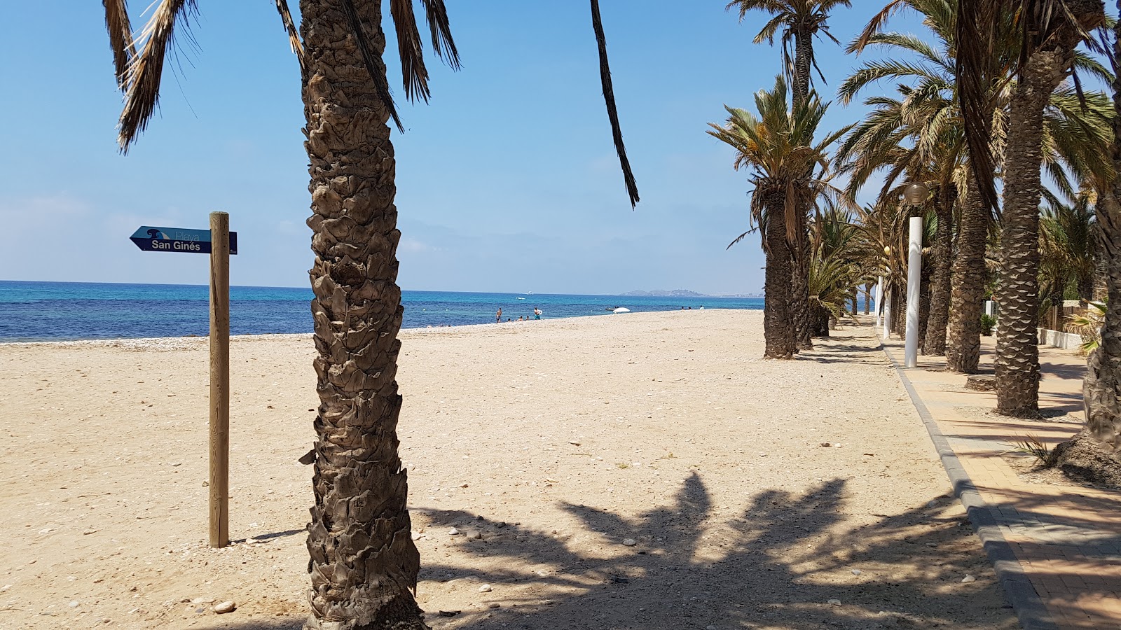 Photo of Playa de San Gines with gray sand &  rocks surface