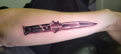 Explore tattoo ideas pin up, creative tattoo ideas in Angola, available at Hoodlum Ink