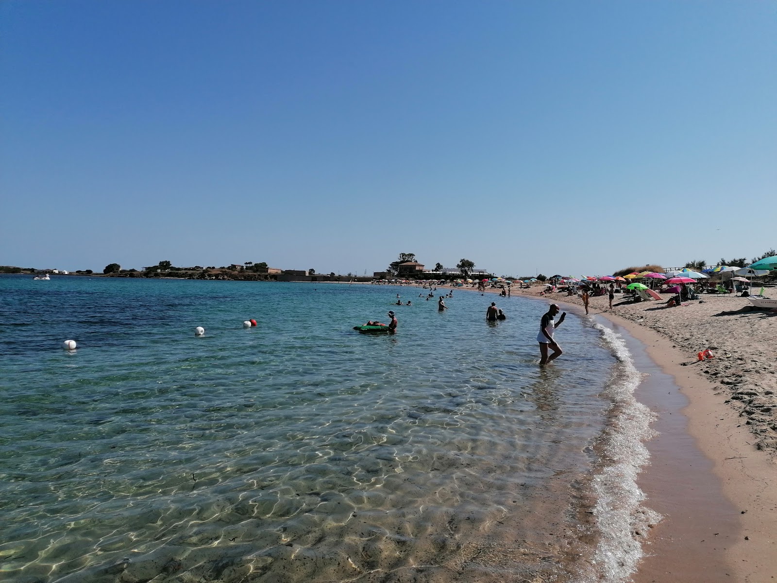 Photo of Spiaggia di Nora with spacious bay