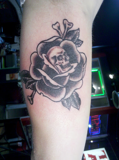 Find in between breast tattoo ideas for your next unique tattoo in Reno at Aces Tattoo