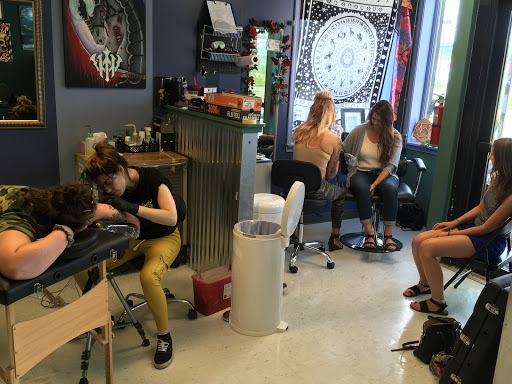 Explore spine tattoo ideas for females, creative tattoo ideas in Kent, available at War Horse Ink