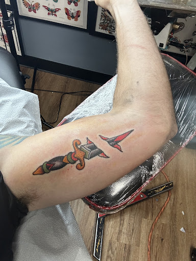 Explore small rose tattoo ideas, creative tattoo ideas in Tulsa, available at Dire Wolf Tattoo