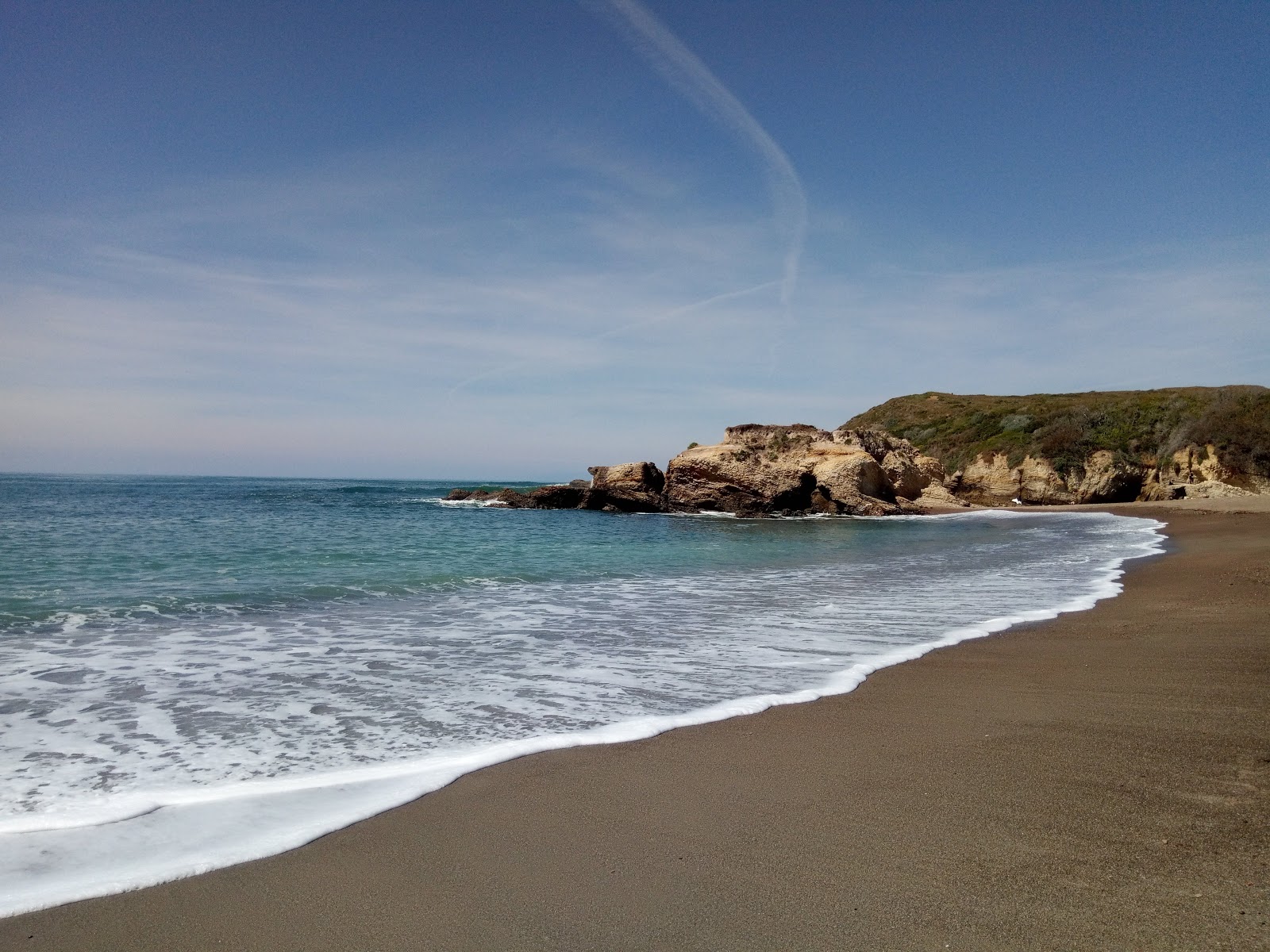 Photo of Spooner's Cove Beach with turquoise pure water surface